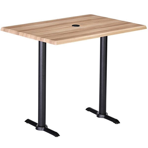 A Holland Bar Stool natural wood laminate bar height table with black end column base.