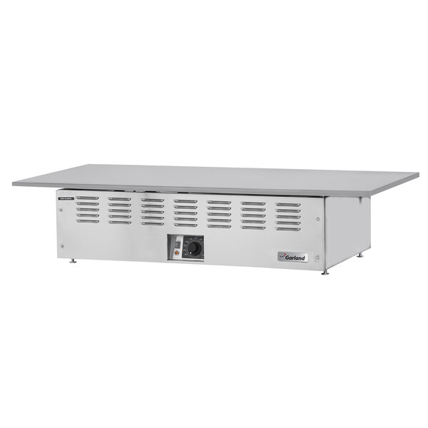 A Garland stainless steel electric drop-in Teppanyaki griddle on a stainless steel counter.