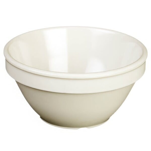 An ivory melamine bowl with a white rim.