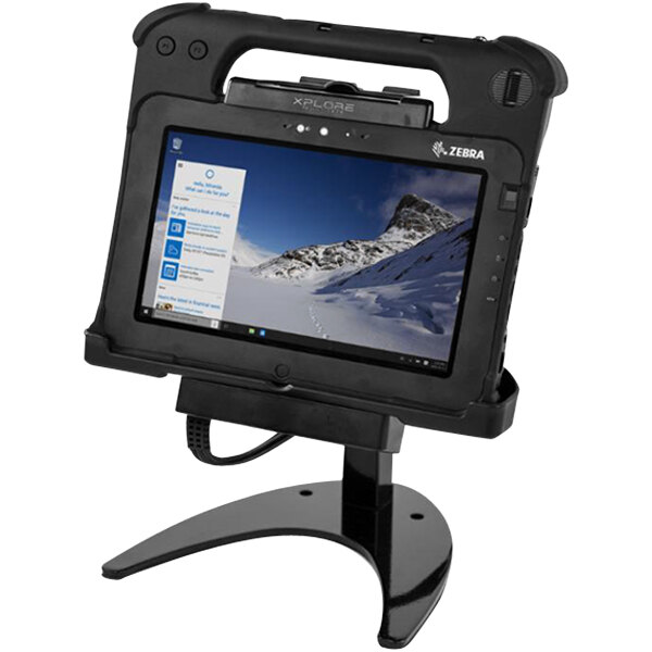 A Zebra L10 rugged tablet on a black industrial docking station stand.