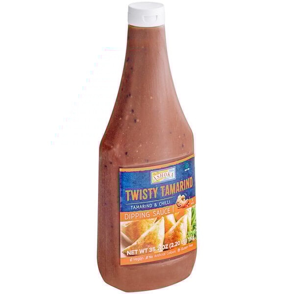 A close-up of a bottle of Ashoka Twisty Tamarind Dipping Sauce with a label.