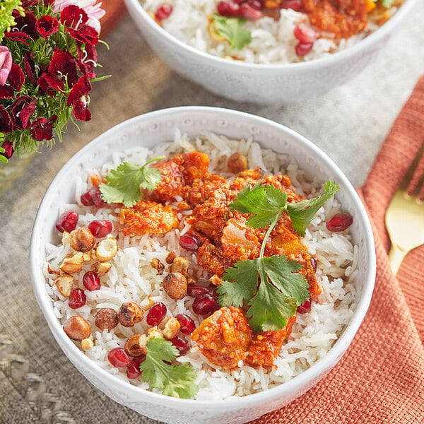 A bowl of rice with Ashoka Mixed Pickle.