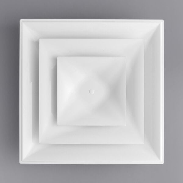 A white square American Louver Company Stratus diffuser with a circle in the center.