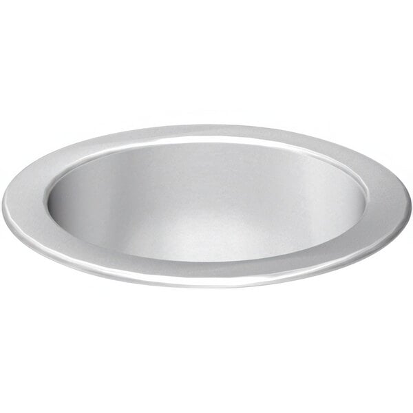 A stainless steel countertop round waste chute in a circular sink.