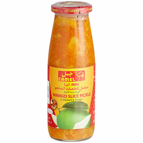 A case of glass jars of sliced mango pickle with a label on the table.