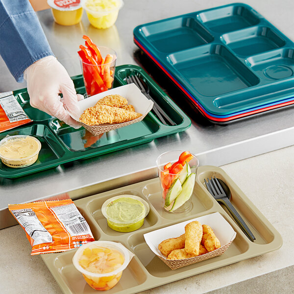 A black Choice compartment tray with food and a fork on it.