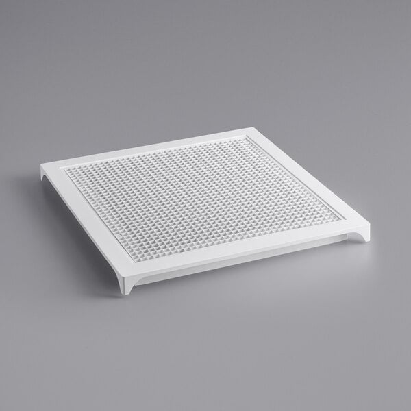A white square Stratus return grille with holes in it.