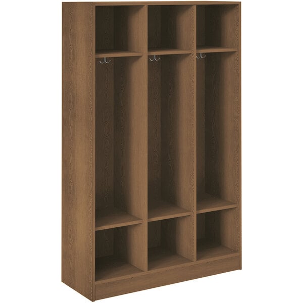 A dark walnut wooden locker with three shelves and hooks.