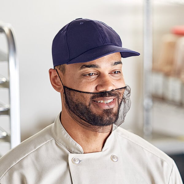 A man wearing a brown Choice nylon beard net and chef's hat.