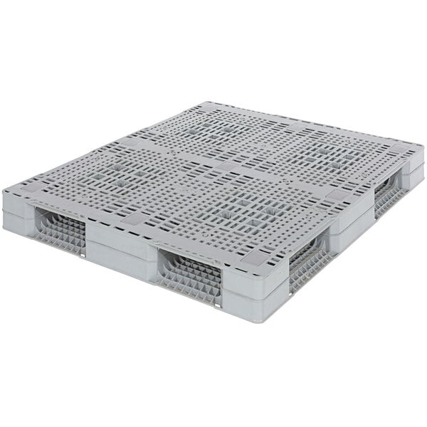 A white plastic pallet with a vented top.