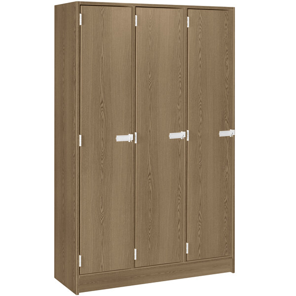 A brown locker with silver handles and three doors.