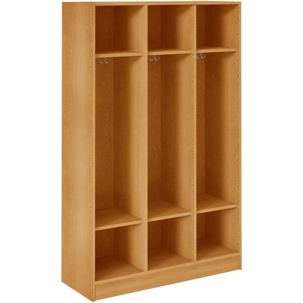 A maple wooden locker with three shelves and two doors.