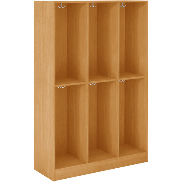 A wooden locker with four doors and shelves.