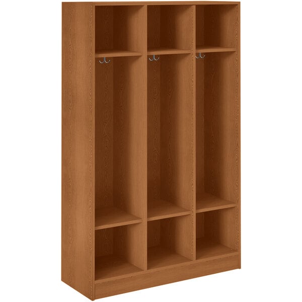 A wooden locker with three shelves and two doors.