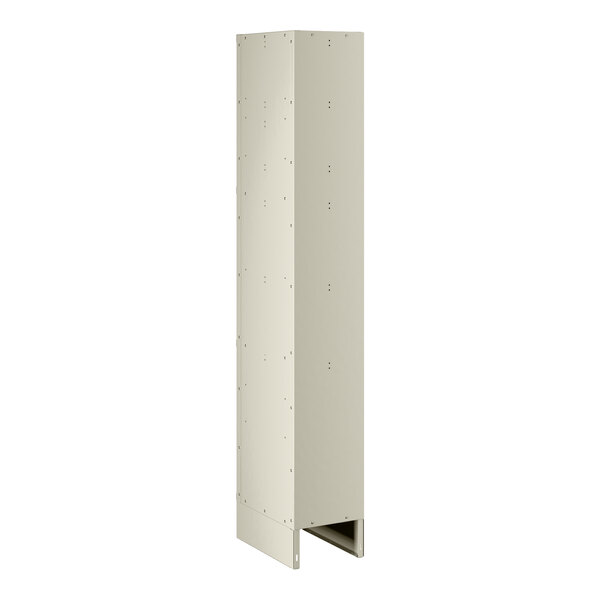 A beige rectangular metal locker with holes in the doors.