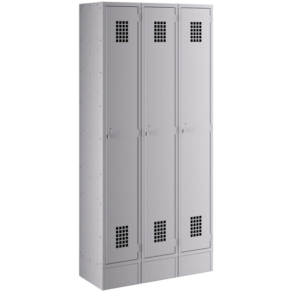 A gray metal Regency locker with 3 wide doors.