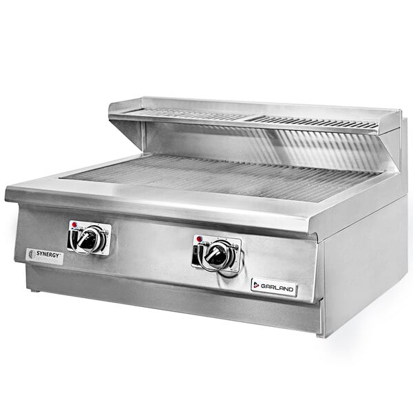 A stainless steel Garland countertop charbroiler with two knobs.