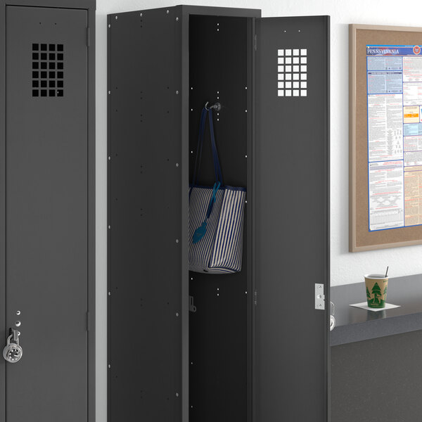 A black Regency single tier locker with a blue and white striped bag inside.