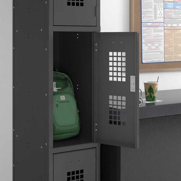 A black Regency single locker with a green backpack inside.