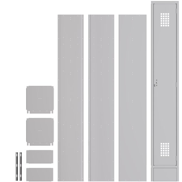 A group of unassembled grey metal lockers with various metal parts.