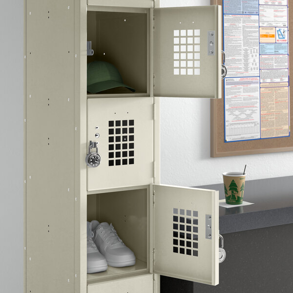 A Regency beige single tier locker with shoes and a hat on top.