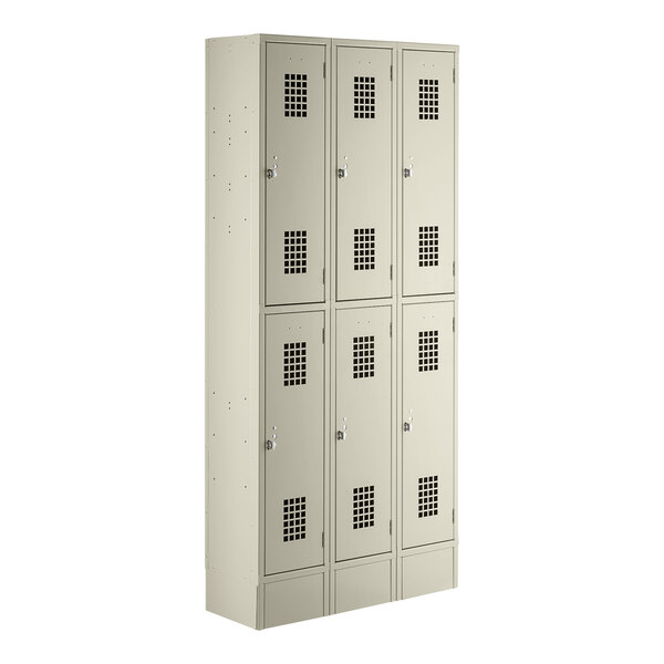 A group of white Regency Space Solutions metal lockers with twelve doors.
