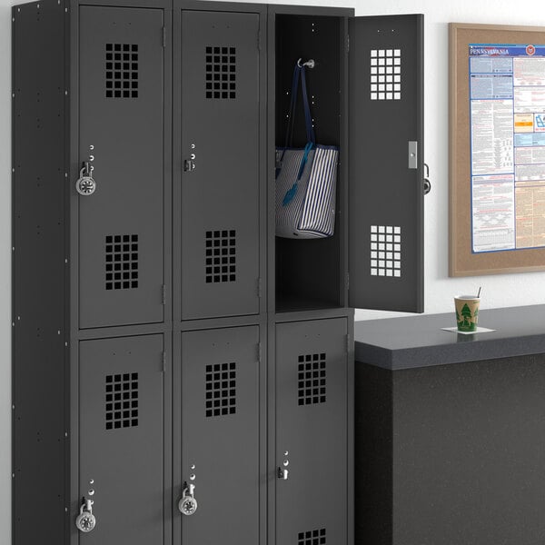 A black Regency locker with two wide doors, one open to reveal a blue and white striped bag inside.
