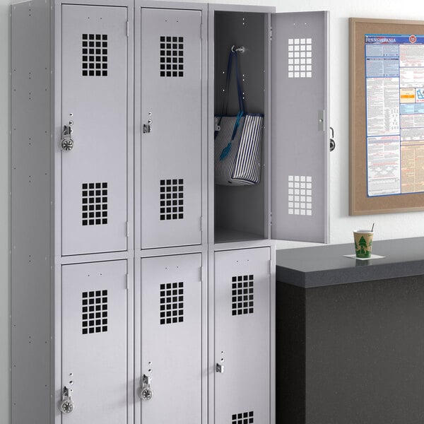 A group of Regency gray 3 wide, 2 tier lockers.