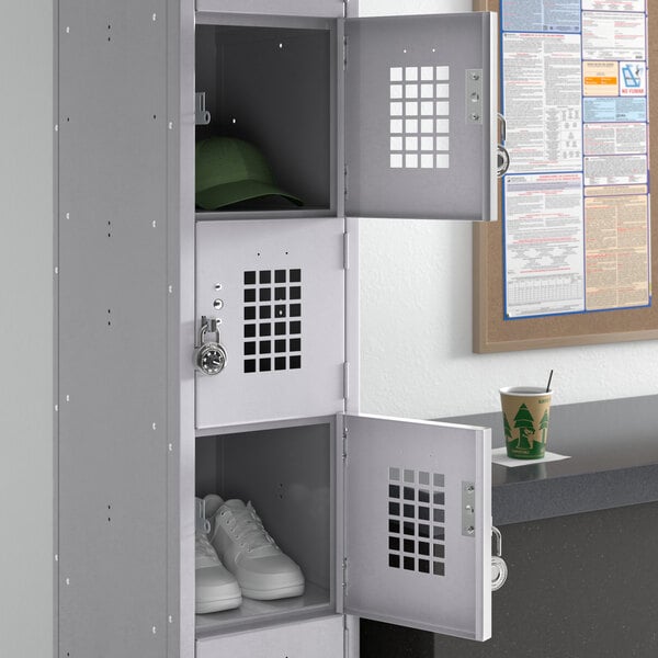 A Regency 6 tier locker with shoes and a hat stored in it.