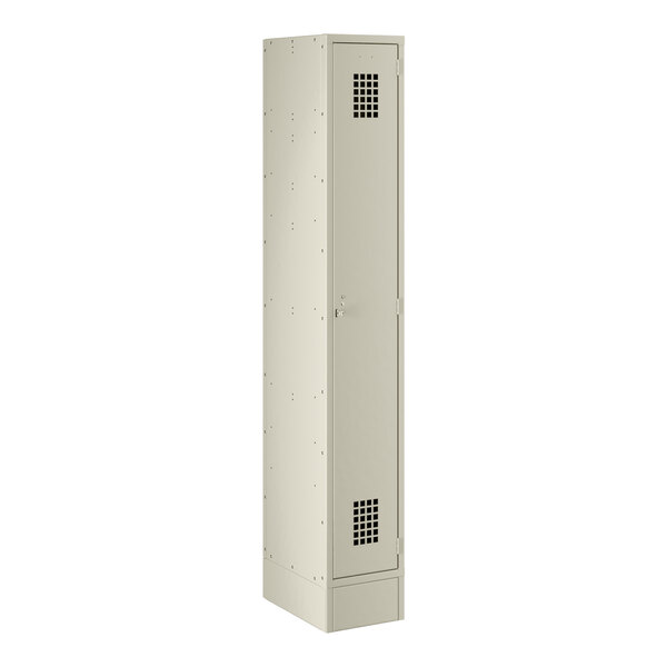 A beige metal Regency locker with a door and holes on the side.