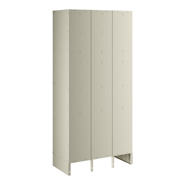 A beige metal locker with three wide doors and two tiers.