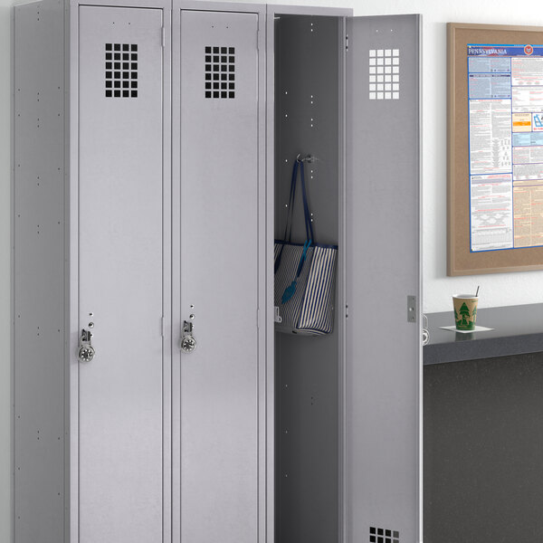 A gray Regency locker with three wide doors.