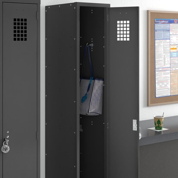 A black Regency single tier locker with a blue and white striped bag inside.
