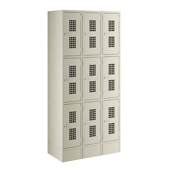 A beige metal Regency locker with 3 wide, 3 tiered sections and 9 doors.