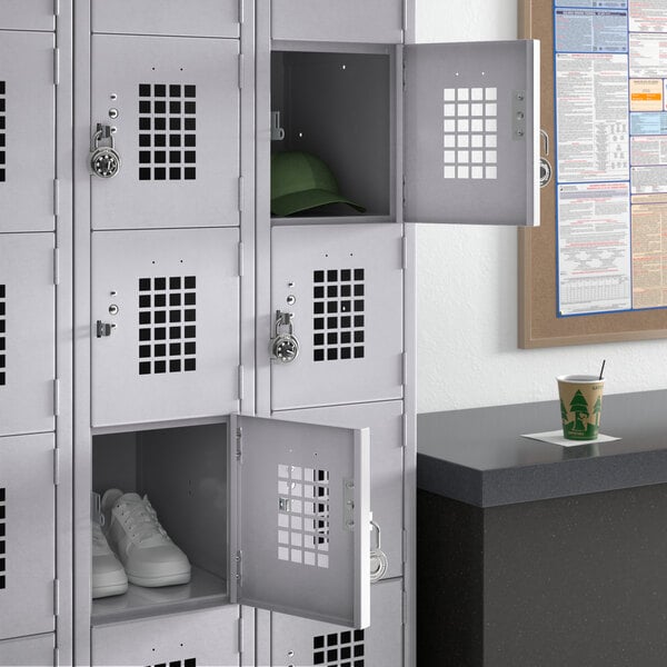 A Regency 3 wide locker with shoes and a hat in the front.