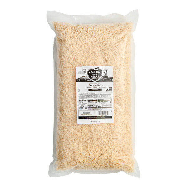 A large vacuum-sealed bag of Follow Your Heart dairy-free vegan shredded Parmesan cheese.