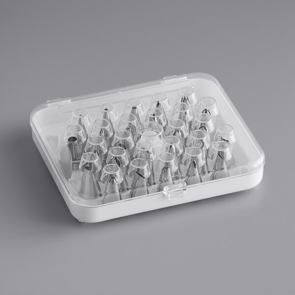 A plastic container holding 26 stainless steel piping tips.