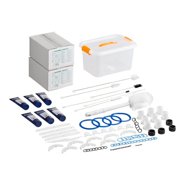 A maintenance kit for Spaceman 6378-C and 6378D-C soft serve ice cream machines, including cleaning brushes, gaskets, lubricants, replacement parts, and a storage container.
