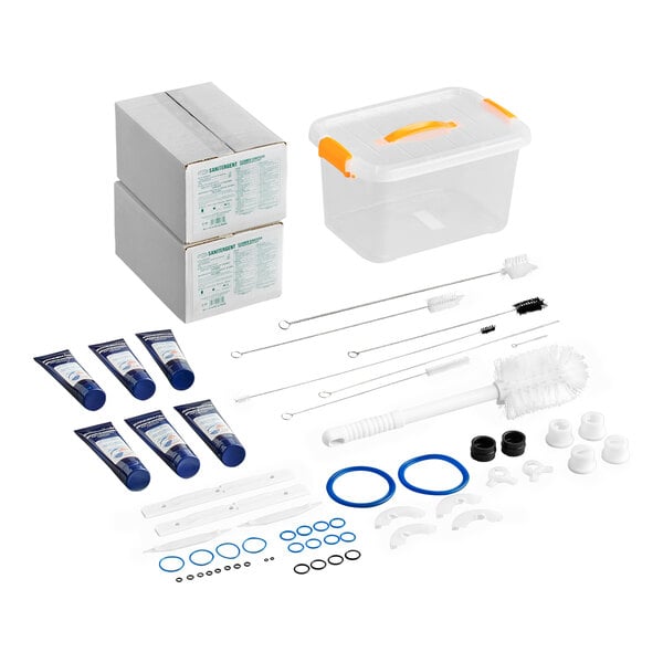 A maintenance kit for the Spaceman 6210 soft serve ice cream machine, including cleaning brushes, gaskets, lubricants, replacement parts, and a storage container.