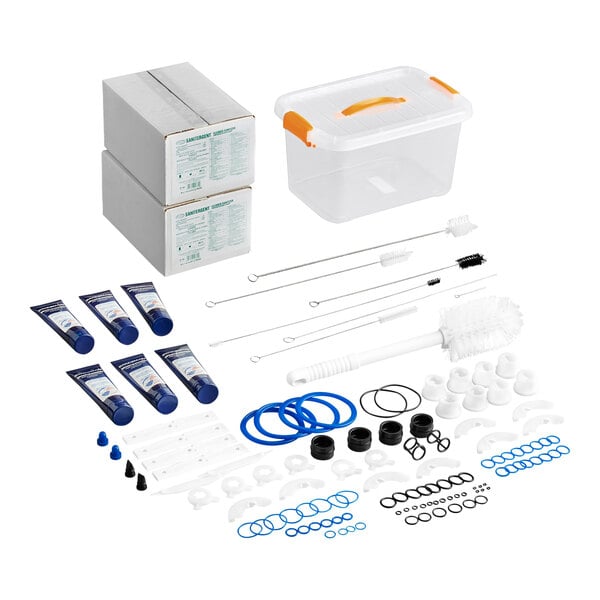 A maintenance kit for Spaceman 6235A-C and 6250A-C soft serve ice cream machines, including cleaning brushes, gaskets, O-rings, lubricants, and storage container.