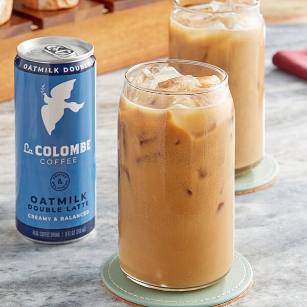 Two glasses of La Colombe Oatmilk Double Latte on a table.