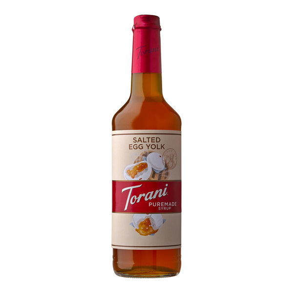 A Torani Salted Egg Yolk flavoring syrup bottle with a label.
