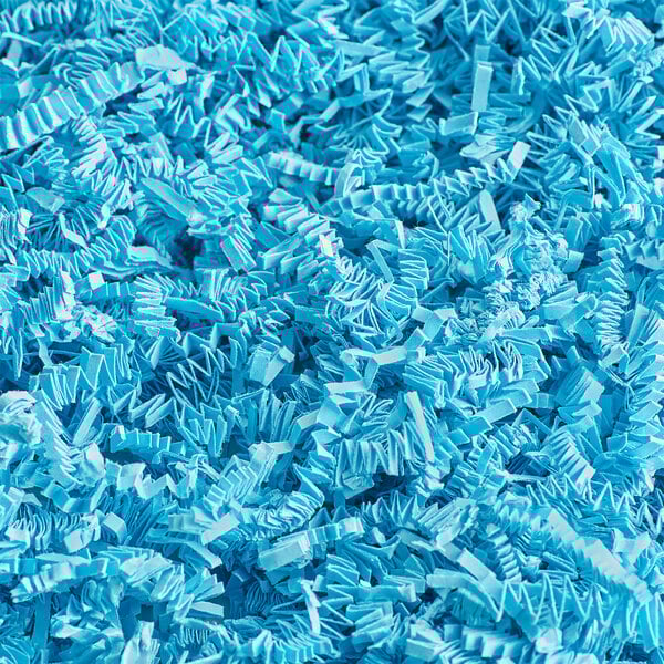 Spring-Fill Light Blue Crinkle Cut Paper Shred in a pile.
