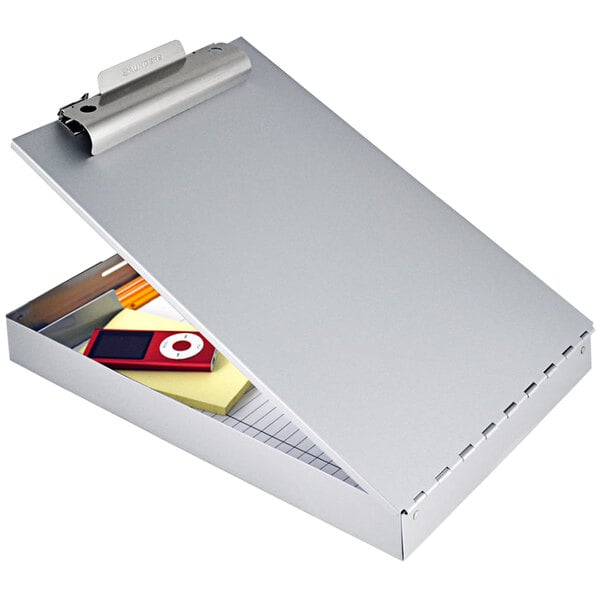 A Saunders aluminum storage clipboard with a pad of paper and a cell phone inside.