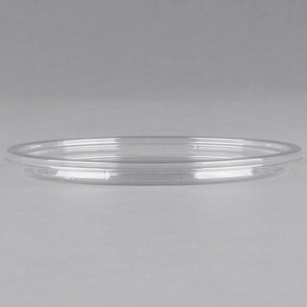 A clear Fabri-Kal deli container lid on a white surface.
