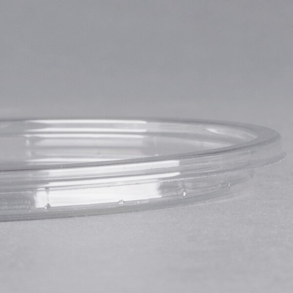 A clear Fabri-Kal deli container lid on a clear container.