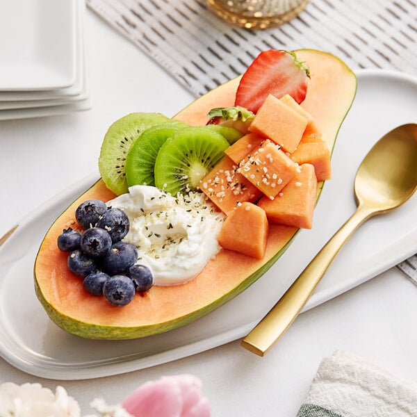 Cubed orange Fresh Solo-Type Papaya in a papaya shell.