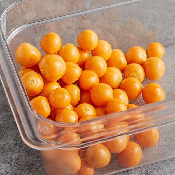 A plastic container of round orange Fresh Peeled Golden Berries.