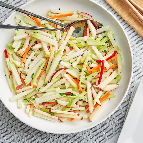 A close up of a pile of fresh green chayote squash