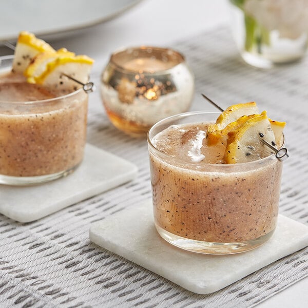 A plate with a glass of fresh yellow dragon fruit and lemon slices.